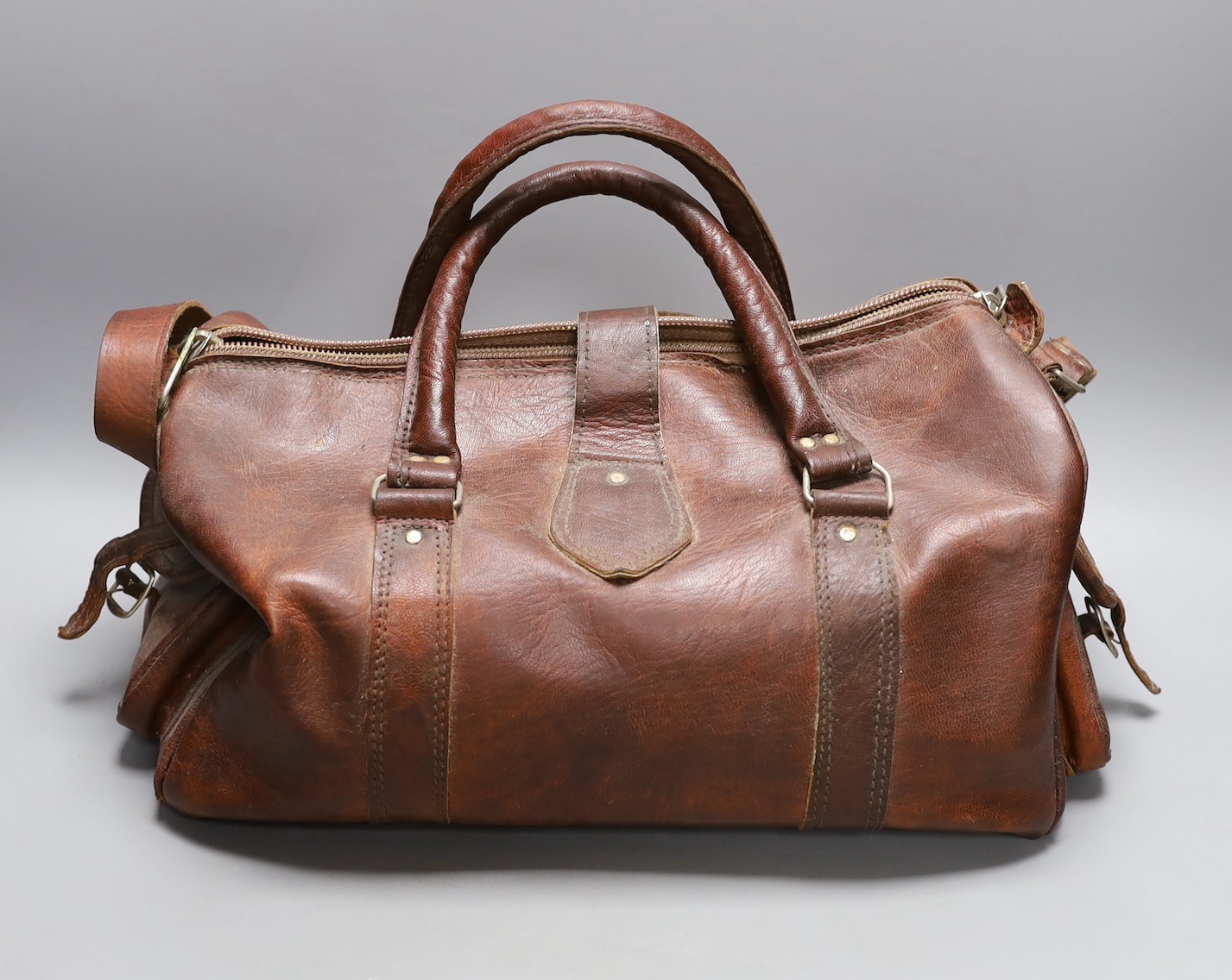 A brown leather Gladstone type bag